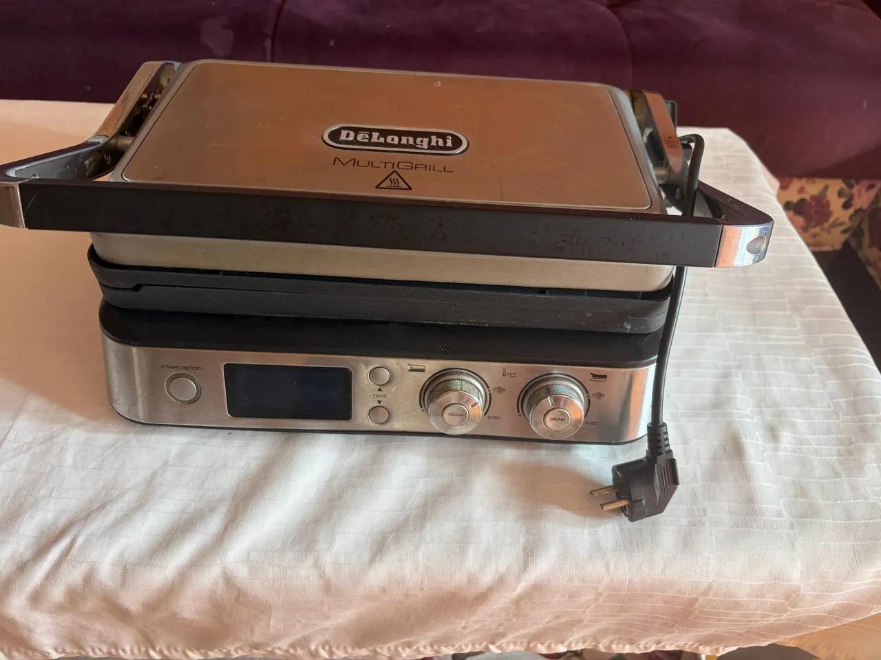 Электрогриль DeLonghi со сменными пластинами Белград