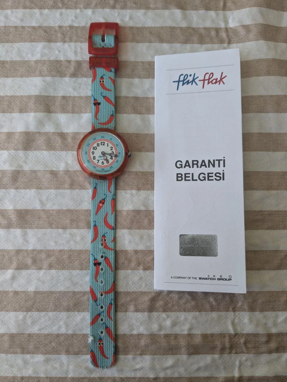 Часы Swatch Flik Flak шлем Decathlon проектор Lumicub 1